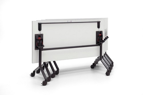 Tilt-top tables nested together for easy storage