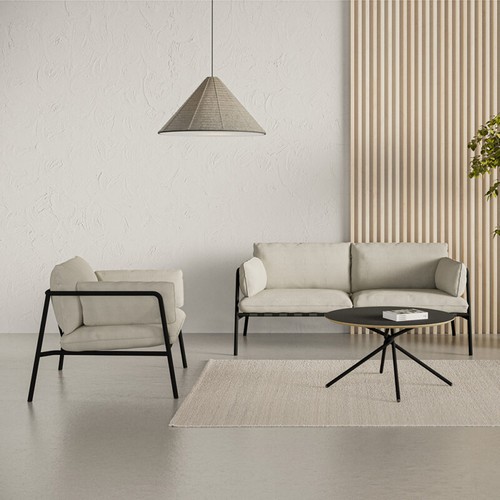 A Twyst coffee table in black | Vyo sofa nd armchair